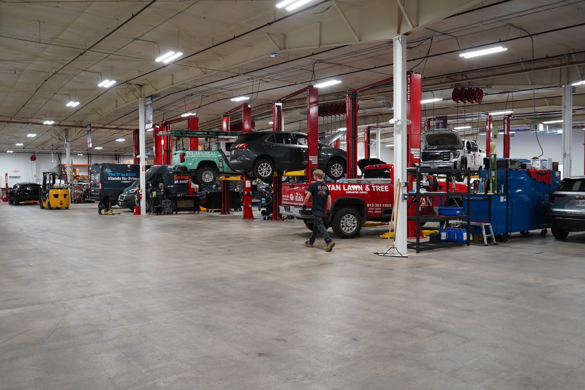 Fleet of commercial work vans and service trucks used by local Kansas City area trade businesses