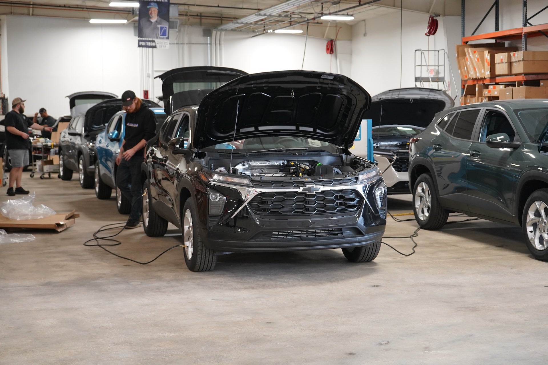 Technician servicing a commercial work truck tire in the service bay