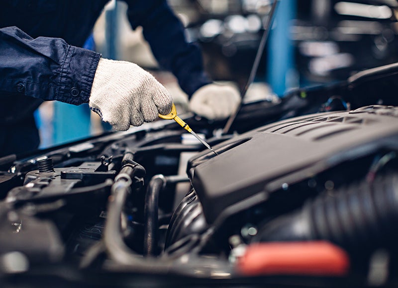 Technician oil change on commercial delivery van